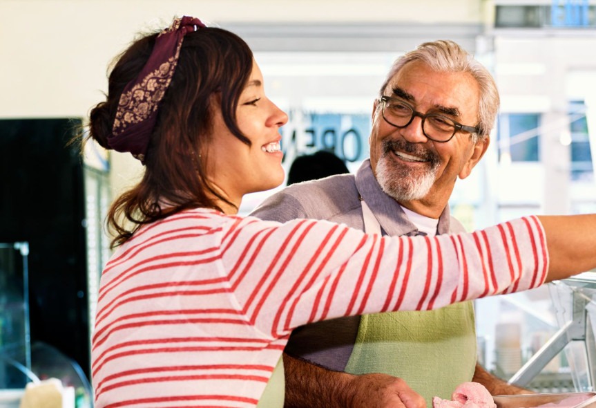 Shop employees smiling while working together